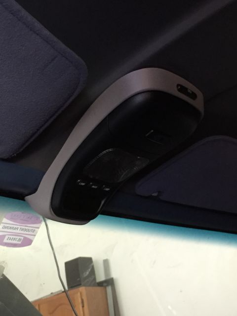 1988 Ford Bronco - Close-up of the interior overhead console and sun visors, showing buttons and the console's housing.