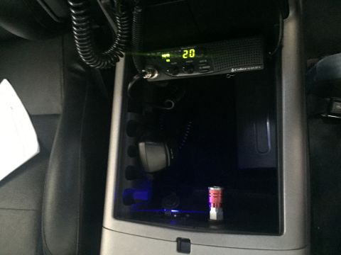 1988 Ford Bronco - Interior view of a vehicle's center console, equipped with a CB radio and ambient lighting.