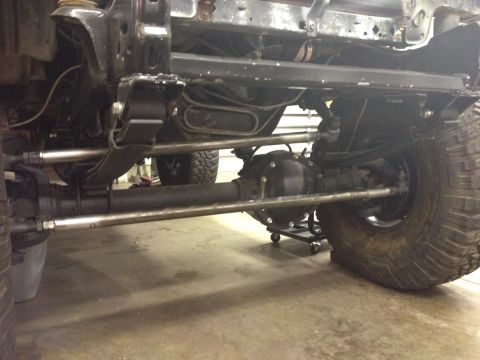 1988 Ford Bronco - Close-up view of the front axle and suspension system on a 1988 Ford Bronco.