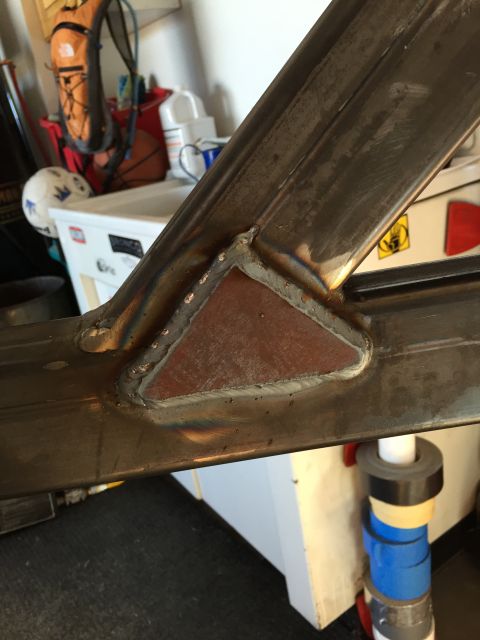 1988 Ford Bronco - A close-up view of a welded metal joint, likely part of a custom fabrication project. The weld shows discoloration and some spatter, indica…