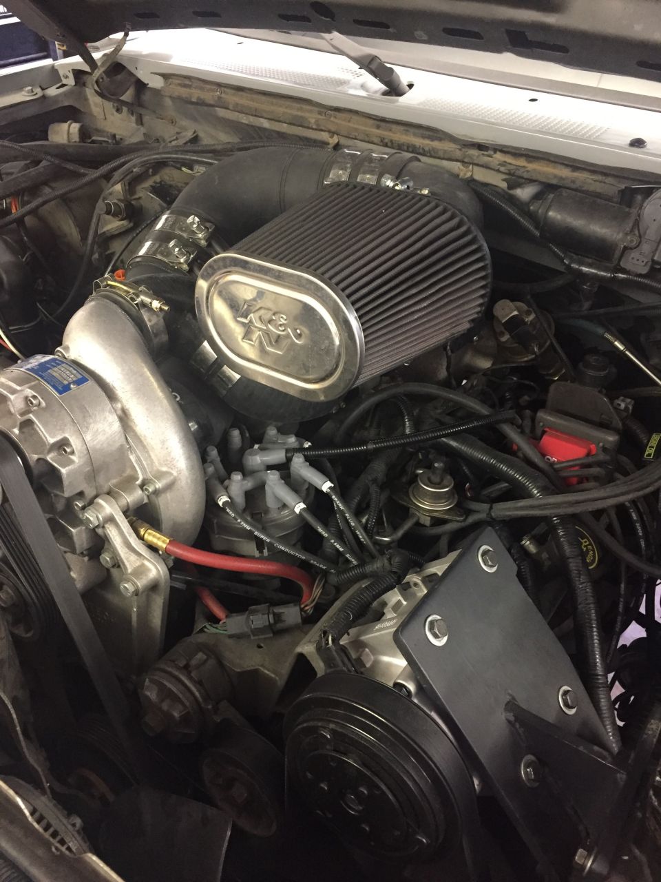 Engine bay with supercharger and K&N air filter