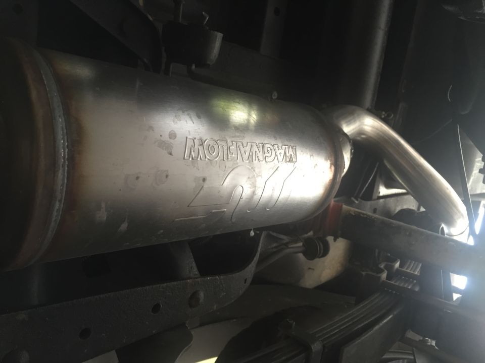 Underside of vehicle showing Magnaflow exhaust muffler and pipe.