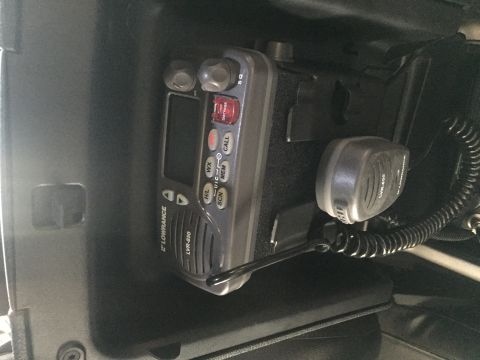 1988 Ford Bronco - A Lowrance LVR-850 VHF radio and microphone are mounted inside a vehicle's dashboard area. The radio has a digital display and several butt…