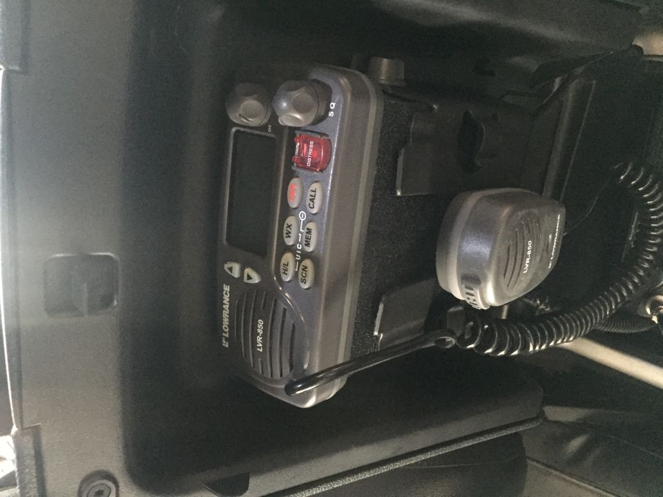 Lowrance LVR-850 VHF radio and microphone mounted in vehicle dashboard.