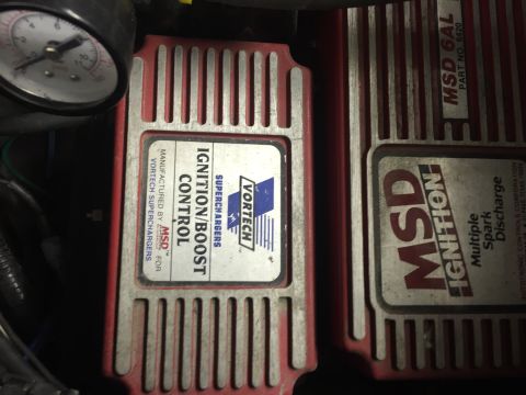 1988 Ford Bronco - Two red MSD ignition control boxes are visible, one labeled "Ignition/Boost Control" and the other "MSD 6AL". A gauge is partially visible…
