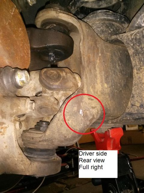 1996 Ford Bronco - This is a close-up rear view of the driver's side suspension components of a 1996 Ford Bronco. The image highlights the ball joint and stee…