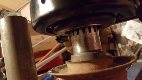 1973 Ford F-100 - A close-up view shows the splined shaft of a vehicle part, possibly a pulley or hub, connected to a black housing. The metal shaft has visi…