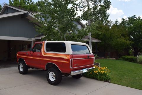 1978 Ford Bronco - This 1978 Ford Bronco is parked in front of a suburban home with a garage.