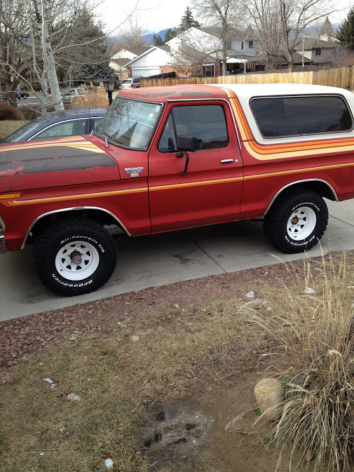 1978 Ford Bronco side view, red with orange and yellow stripe accents