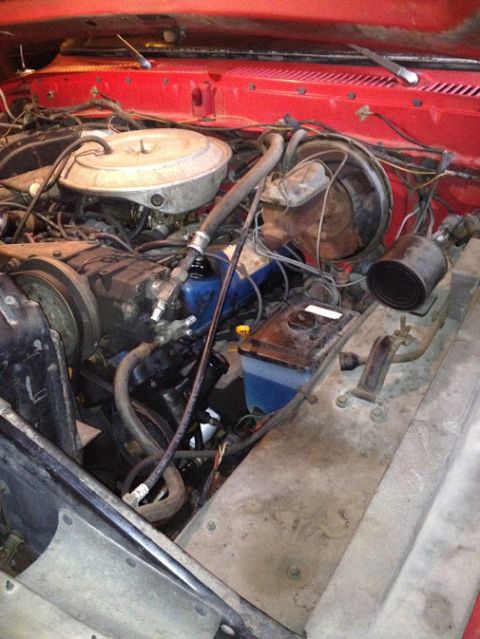 1978 Ford Bronco - Engine bay details of a V8 vehicle, showing various components and red firewall paint.