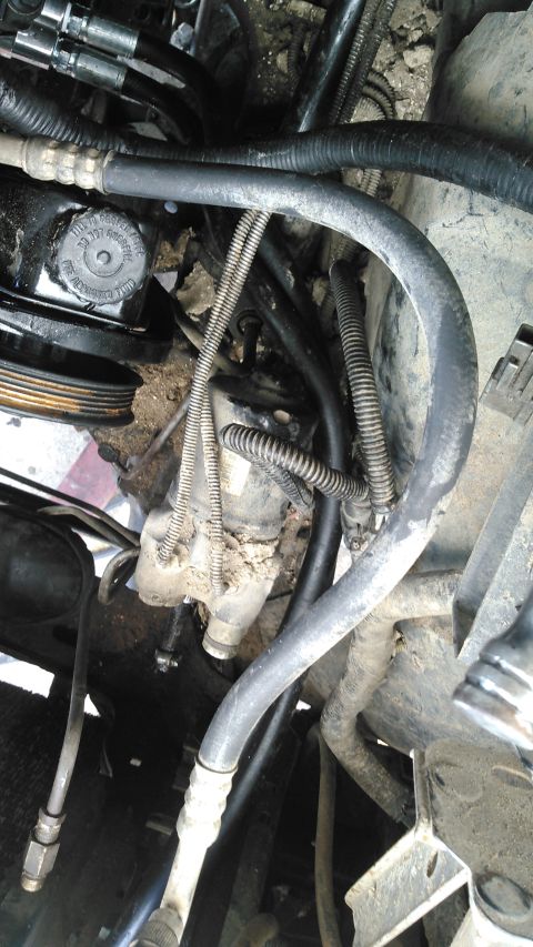 1996 Ford Bronco - i have the hoses ran over the top of the 4WABS pump between it and the wheel-well. i have the hose for the filter going through the opening…
