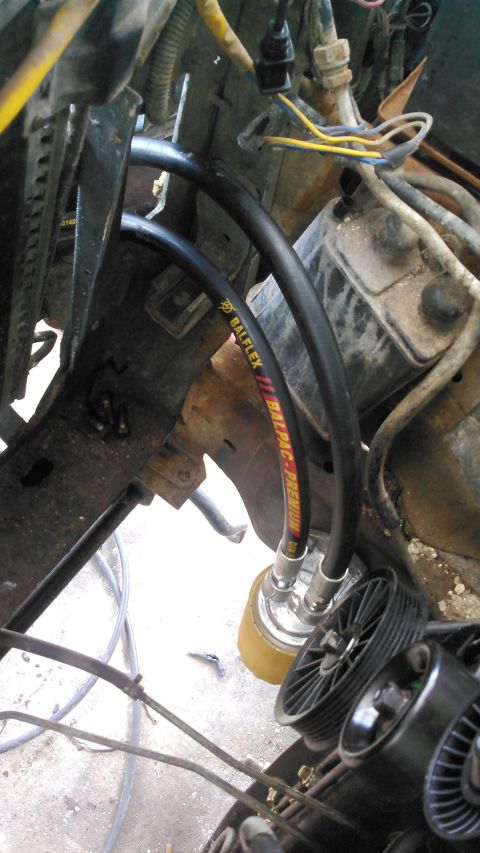 1996 Ford Bronco - the hoses are running through the passenger side core support cutout and meeting at the filter. tho it doesnt appear to be, i have plenty o…