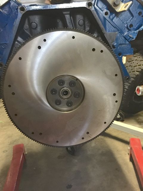 1978 Ford Bronco - A close-up view of a vehicle's flywheel and part of the engine block.