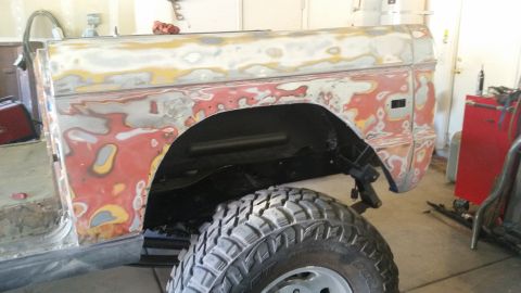 1979 Ford Bronco - This 1978 Ford Bronco body is in a garage, stripped down and covered in primer and body filler for repairs.