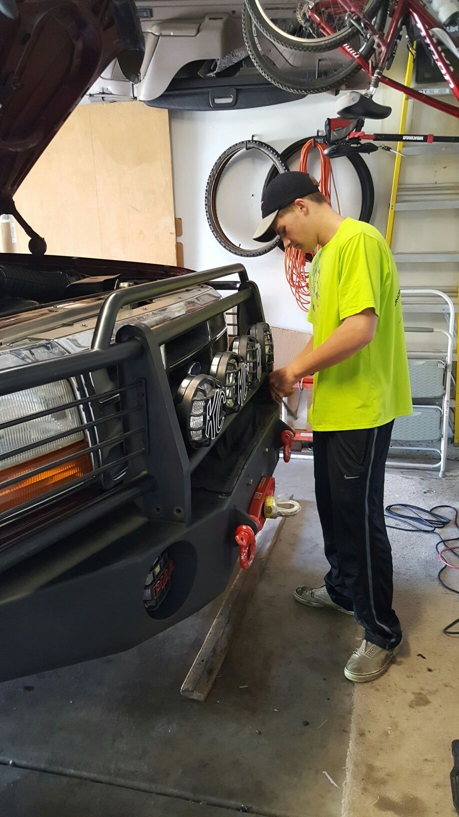 Front bumper with KC lights and red tow hooks
