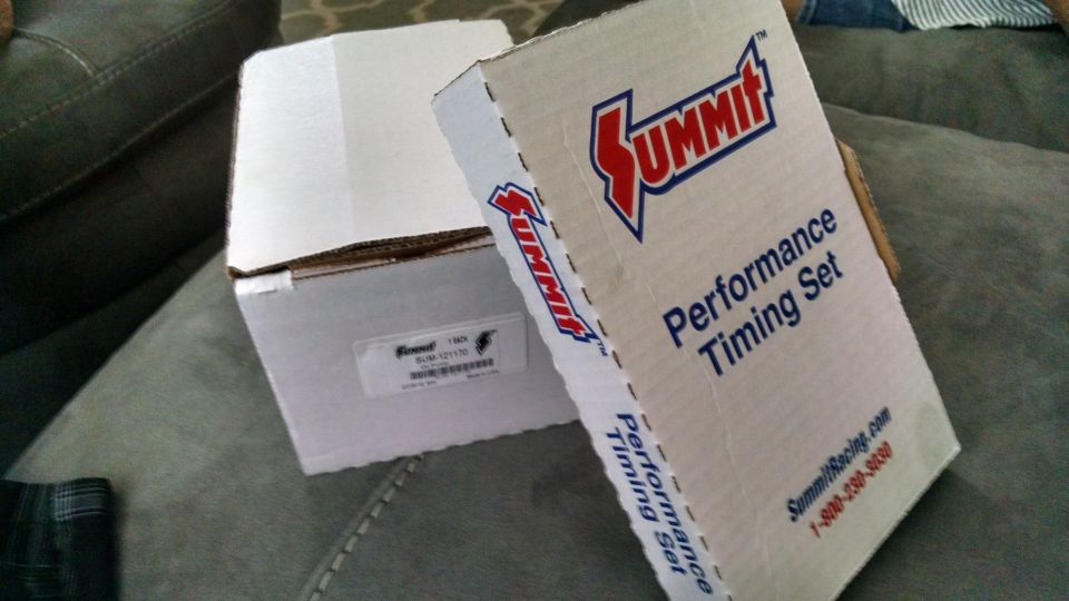 Two boxes of Summit Performance Timing Set parts on a couch