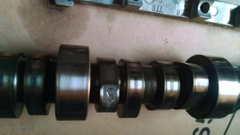 1985 Jeep CJ7 - Camshaft part with visible text 'B.I.I.' and '9'.