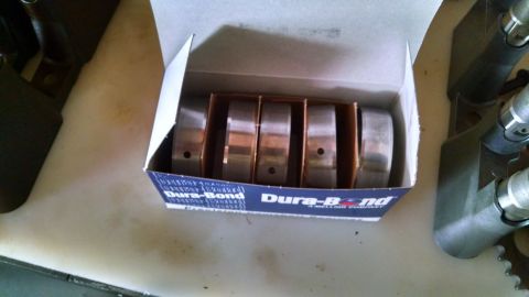 1985 Jeep CJ7 - A box of Dura-Bond engine bearings is shown, with some engine components visible on the sides.