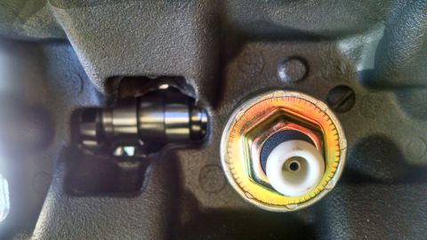 1985 Jeep CJ7 - Engine block with a sensor and internal component visible.