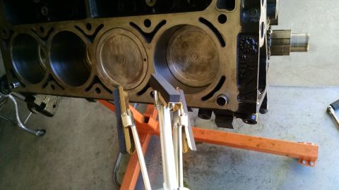 1985 Jeep CJ7 - Engine block on stand with honing tool, ready for rebuild.