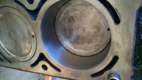 1985 Jeep CJ7 - Engine cylinders showing wear patterns. The pistons are visible within the bores.