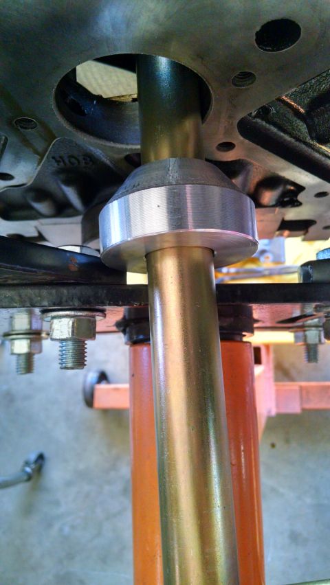 1985 Jeep CJ7 - A close-up view shows a metal shaft and bearing assembly, likely a component of a vehicle's steering or suspension system.