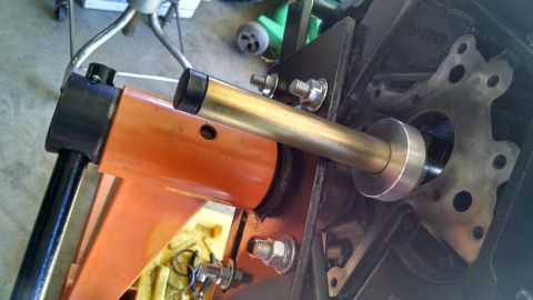 1985 Jeep CJ7 - A close-up view of an engine block being worked on with a specialized tool.