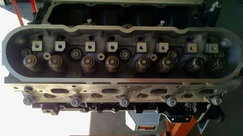 1985 Jeep CJ7 - Close-up of an engine cylinder head, showing internal components and mounting bolts.