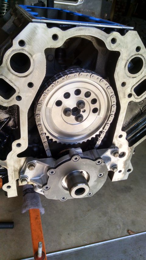 1985 Jeep CJ7 - Close-up view of an engine's timing chain and oil pump assembly, showing intricate mechanical parts.