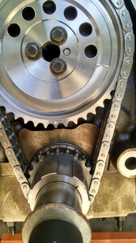 1985 Jeep CJ7 - This photo shows the internal workings of an engine, specifically the timing chain and sprockets.