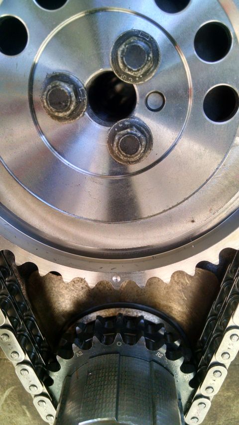 1985 Jeep CJ7 - Engine timing components, including a chain and sprockets, are shown in this close-up view.
