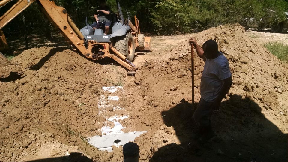 1,000gal septic tank going in the ground just north of the utility room.