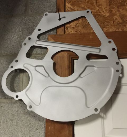 1978 Ford Bronco - This metal plate is likely an adapter for a vehicle's transmission, not a clock.