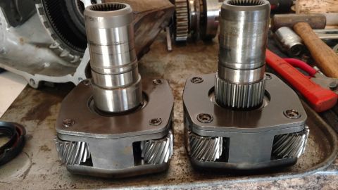 1996 Ford Bronco - Close-up of two transfer case components with visible gears and splines.