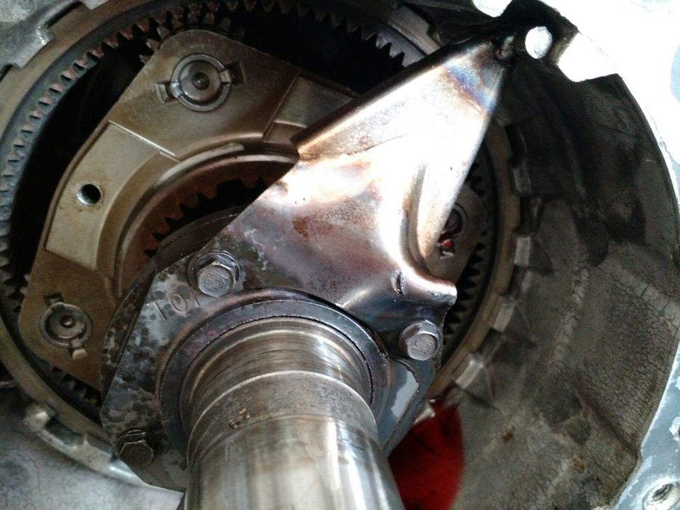 Close-up of internal automatic transmission parts, showing impeller fins and gears.
