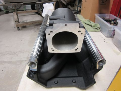 Black intake manifold with polished aluminum tubes
