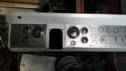 1979 Ford Bronco - A custom dashboard panel for a 1979 Ford Bronco features a mix of installed gauges and marked locations for future additions, including a l…