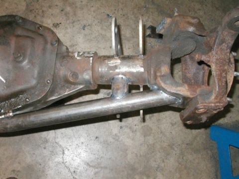 1994 Ford Bronco - Modified Dana 60 axle housing with suspension links, likely for off-road use.