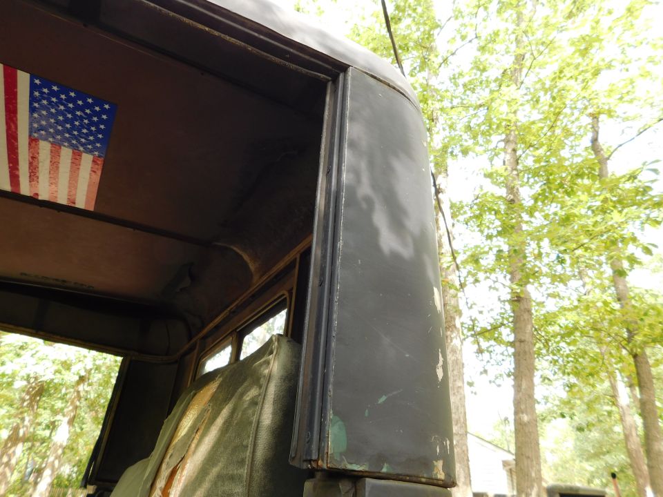 Part of a wooden structure with an American flag visible