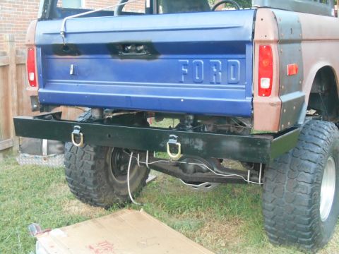 1972 Ford Bronco - Pickup truck chassis with large rear tires and suspension components visible.