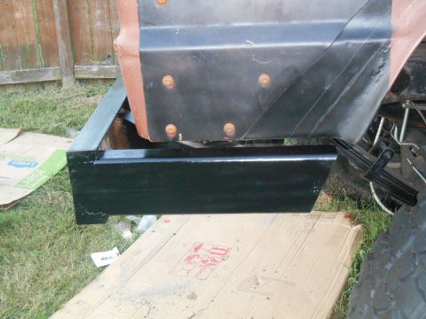 1972 Ford Bronco - A vehicle's lower body panel and step are shown, with evidence of recent work or replacement.