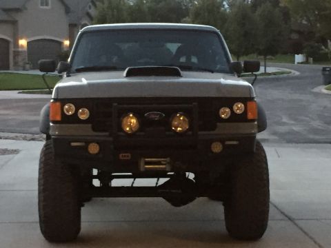 1988 Ford Bronco - Front view of a modified 1988 Ford Bronco, equipped with a winch and off-road lighting.