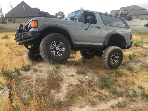 1988 Ford Bronco - This 1988 Ford Bronco is shown off-road with its lifted suspension and large tires.