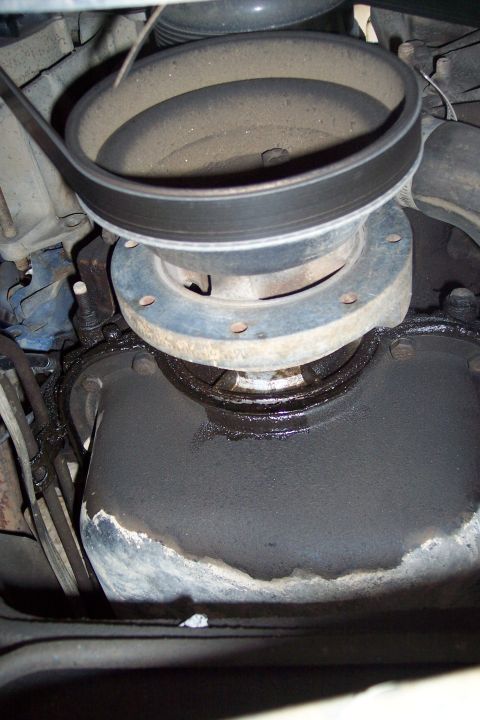 1990 Ford Bronco - Engine pulley and oil pan detail, showing dust and oil leaks.