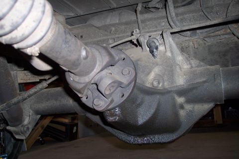 1990 Ford Bronco - Close-up view of the rear differential and driveshaft assembly, likely from a truck or SUV.