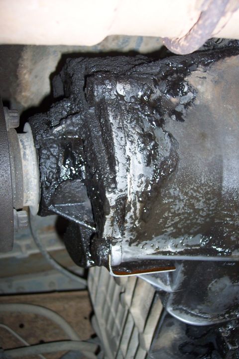 1990 Ford Bronco - Differential housing shows significant grease buildup and potential leaks.