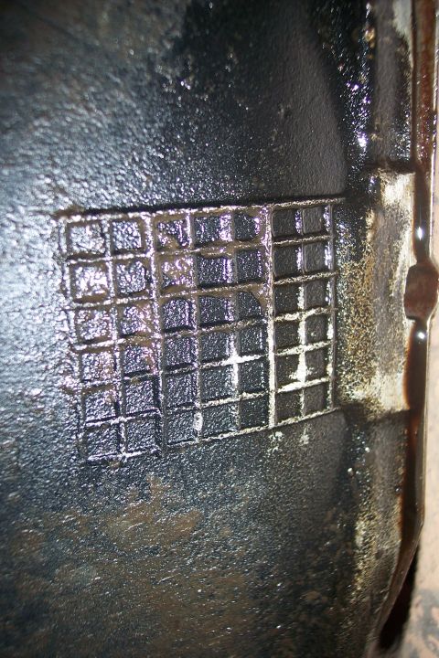 1990 Ford Bronco - A close-up view of a textured metal component, likely from a vehicle's drivetrain.