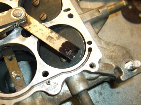 1979 Ford Ranchero - A close-up view of a vehicle's carburetor component, showing internal mechanical parts.