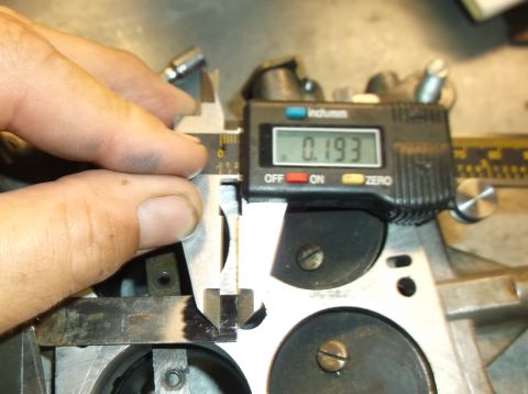 1979 Ford Ranchero - A digital caliper is used to measure a component, with a ruler visible in the background.