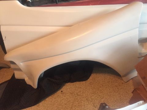 1986 Ford Bronco - A white fender part is shown in this image.